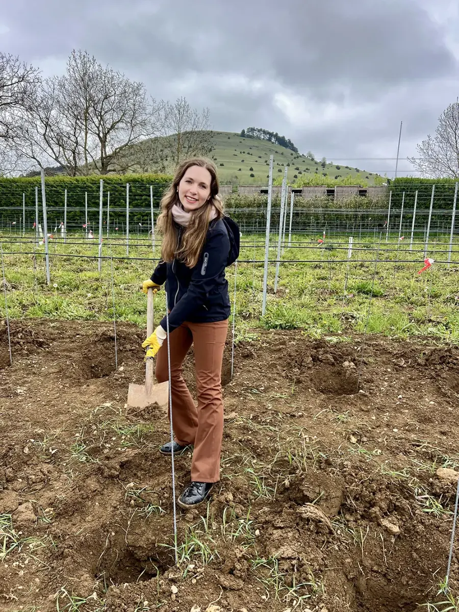 Henrike Maria Heinicke as wineprincess extracting soil for sampling
