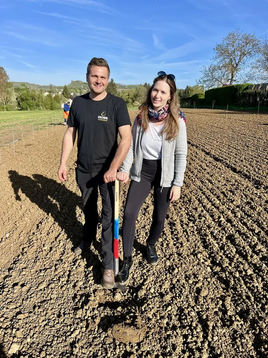 Henrike Maria Heinicke as wineprincess planting a little wine plant