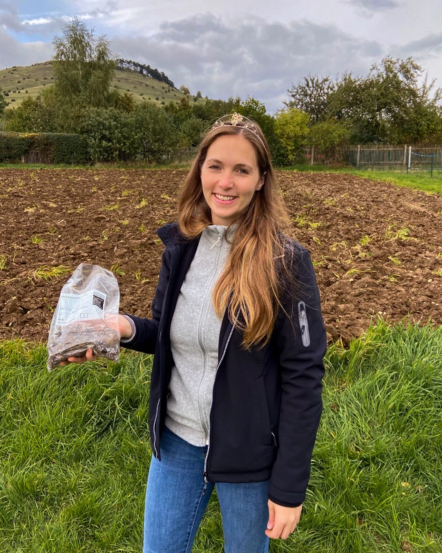 Henrike Maira Heinicke as wineprincess extracting soil for sampeling